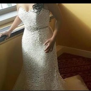 Flawless Strapless Crystal Beaded Tulle Fit And Flare Wedding Gown